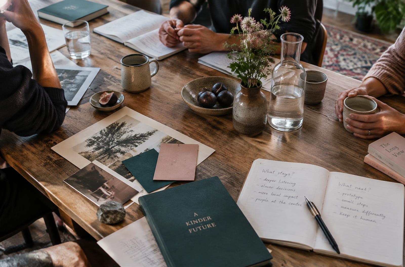 People gathering for a thoughtful conversation around a table